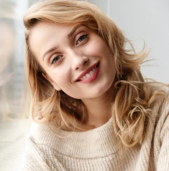 Patient with a natural-looking smile after cosmetic dentistry