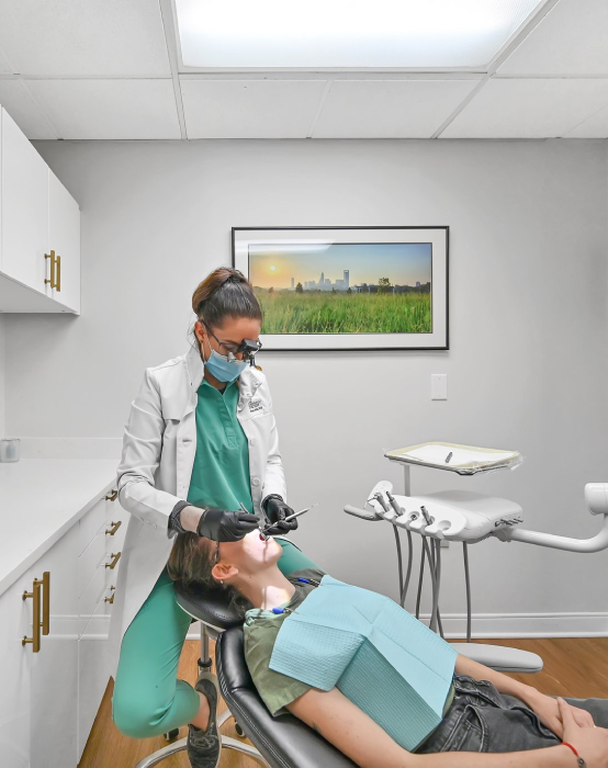 Dr. Hotic examining a patient at her dental office in Charlotte, NC