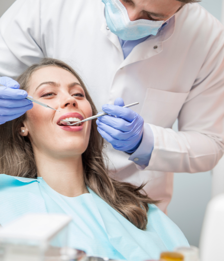Dentist examining the patient near Newell, NC at Dentistry of Uptown Charlotte