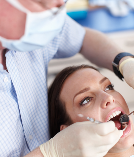 Our dentist examining the patients near Mint Hill